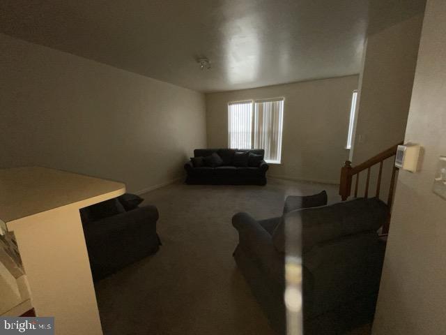 living room featuring carpet flooring