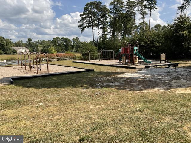 view of playground featuring a lawn