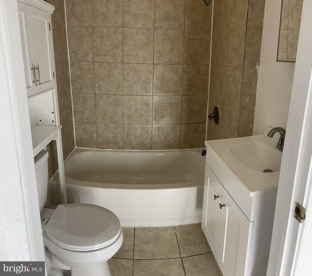 full bathroom featuring tiled shower / bath combo, vanity, toilet, and tile patterned floors