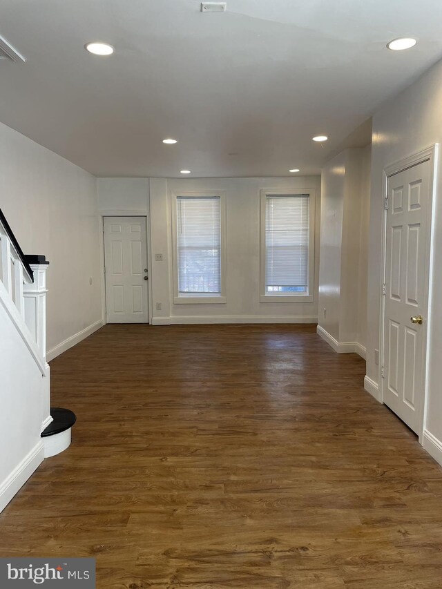 foyer entrance with dark wood-type flooring