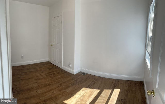 empty room featuring dark hardwood / wood-style floors