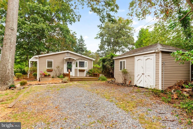 view of front of home with an outbuilding