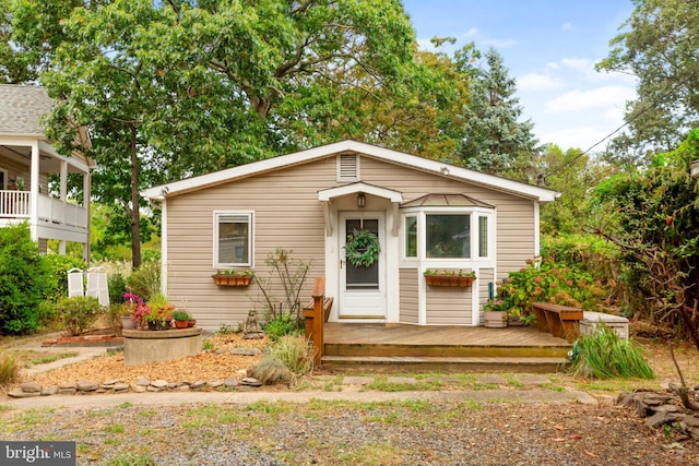 view of front of property featuring a wooden deck