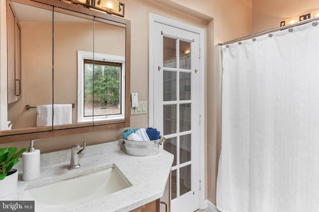 bathroom featuring vanity and walk in shower