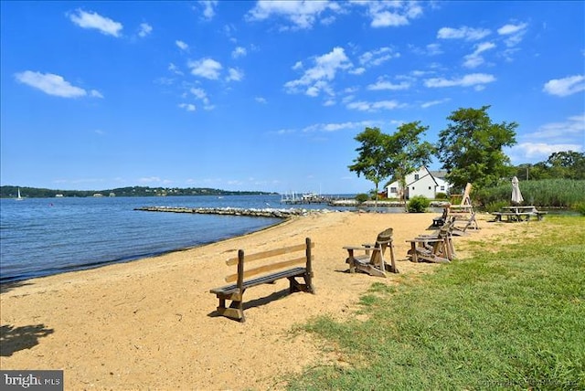 view of community with a water view