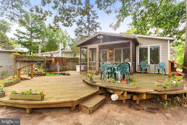 wooden terrace with a sunroom