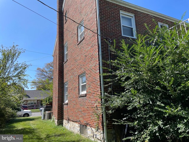 view of property exterior with cooling unit