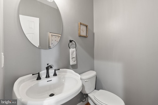 bathroom with toilet and sink