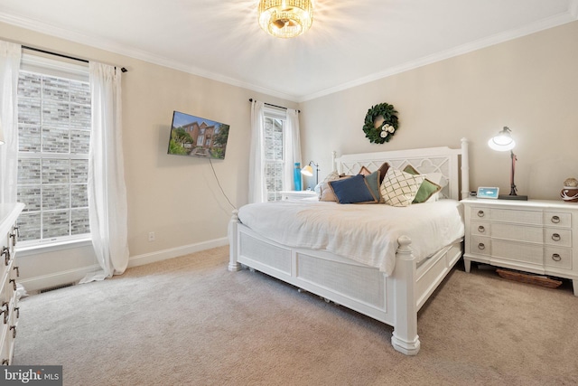 bedroom with ornamental molding and light carpet