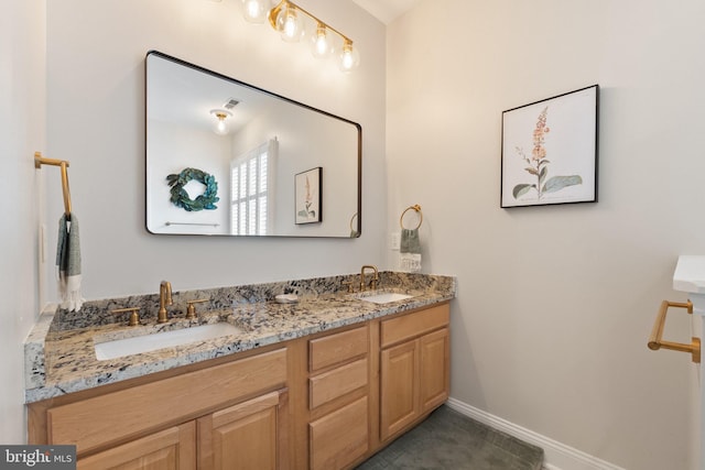 bathroom with tile patterned flooring and vanity