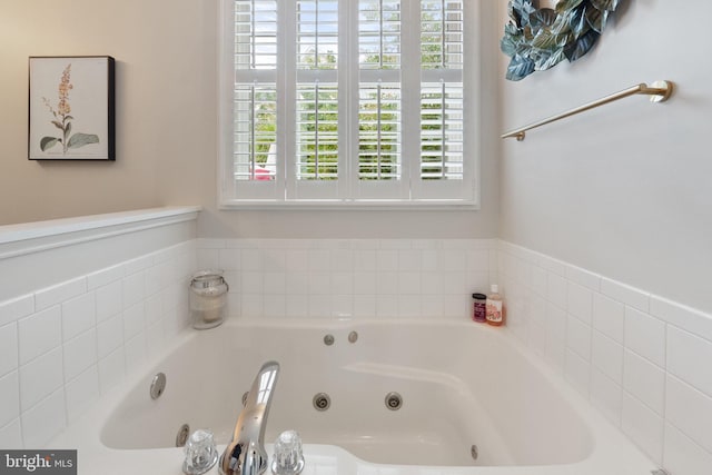 bathroom featuring tiled bath