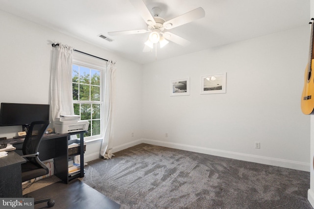 carpeted office space with ceiling fan