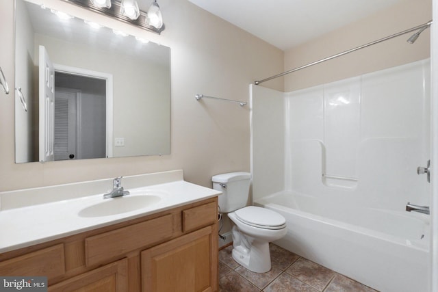 full bathroom with toilet, vanity,  shower combination, and tile patterned floors