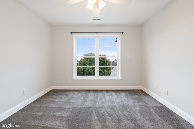 carpeted empty room featuring ceiling fan