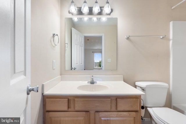 bathroom with vanity and toilet