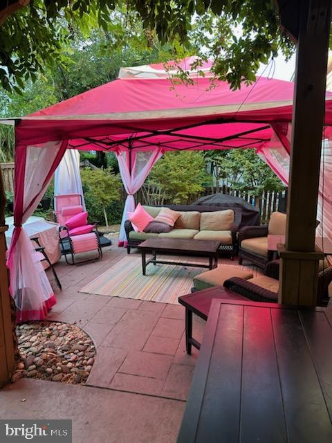 view of patio with a gazebo and an outdoor hangout area