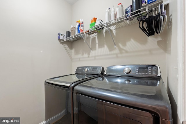 laundry area featuring washing machine and clothes dryer