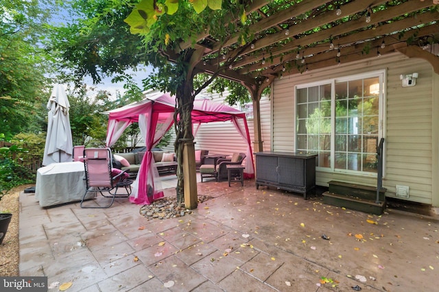 view of patio with a gazebo and an outdoor living space