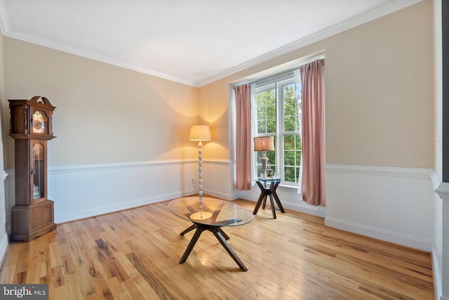 unfurnished room featuring light hardwood / wood-style floors and crown molding