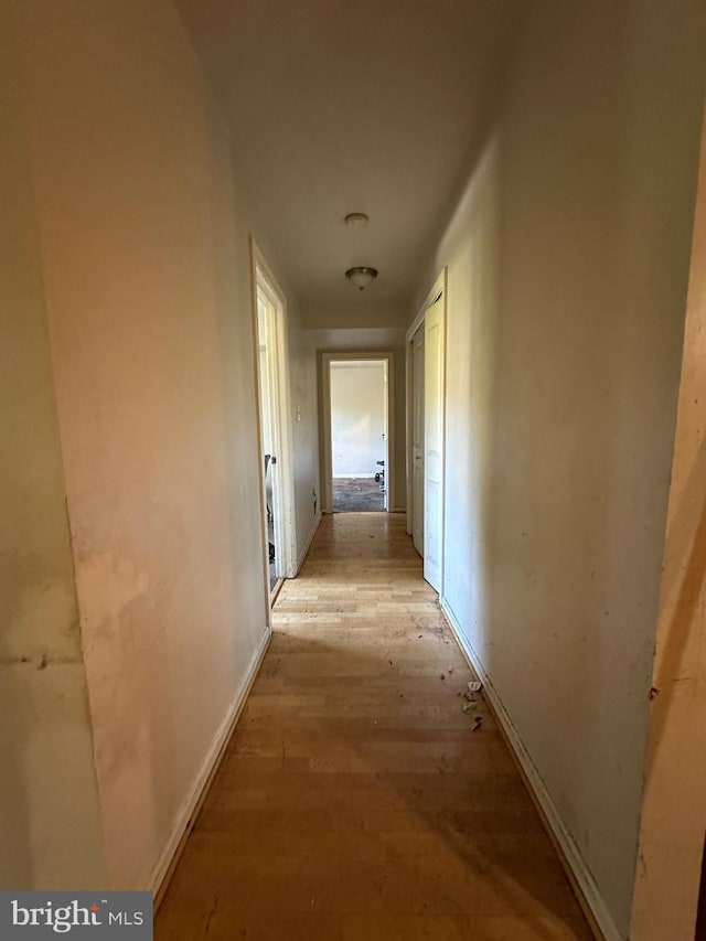 corridor featuring light hardwood / wood-style floors