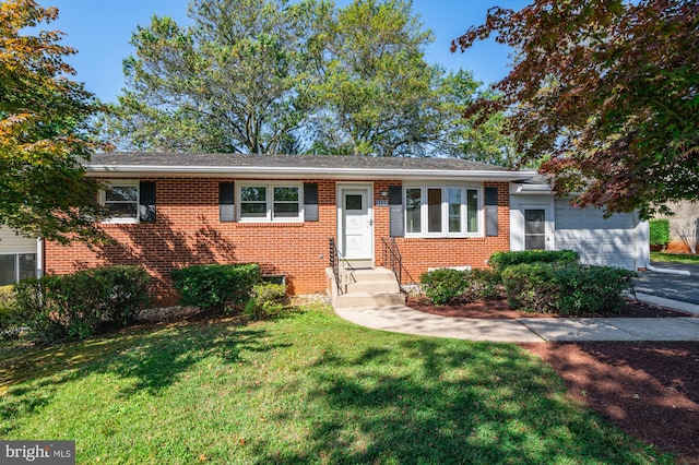 single story home with a front yard and a garage