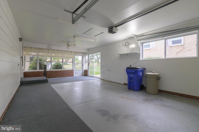 garage with ceiling fan and a garage door opener