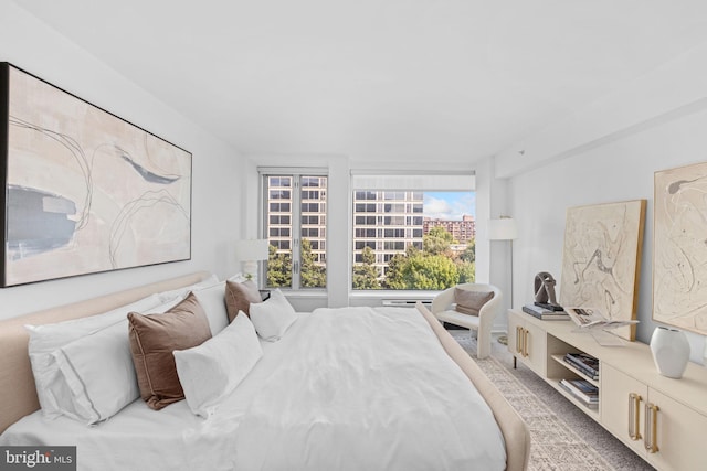 bedroom with light colored carpet