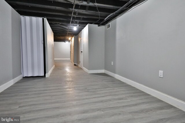 basement with light wood-type flooring