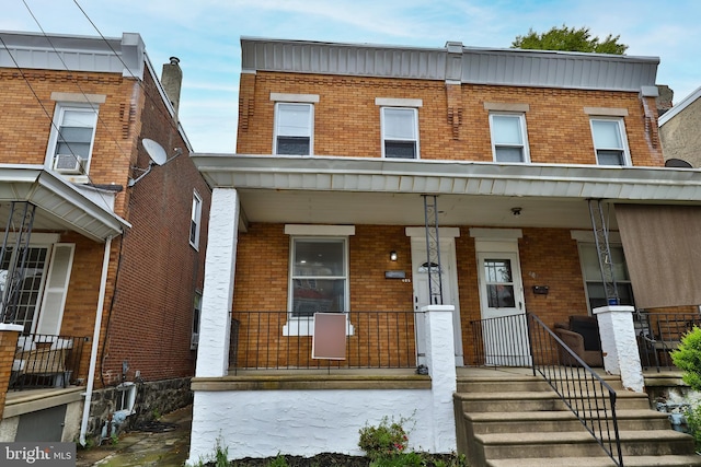 view of property with a porch