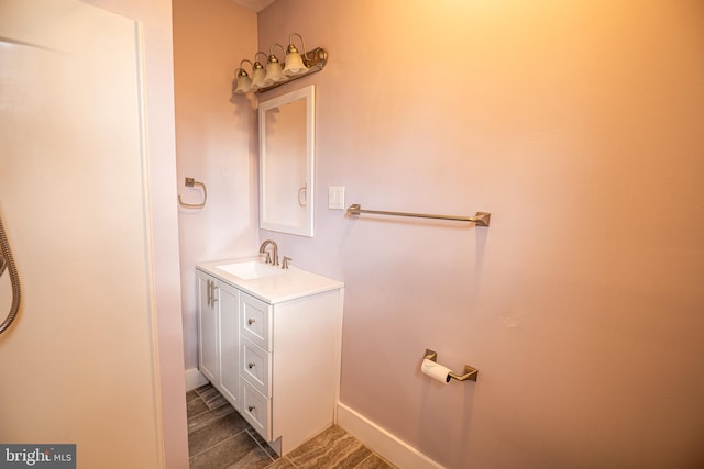 bathroom with vanity and wood-type flooring