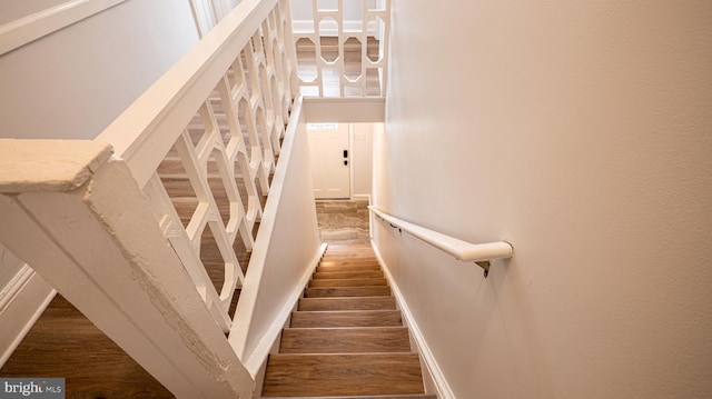 stairway featuring hardwood / wood-style floors