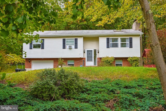 bi-level home featuring a garage