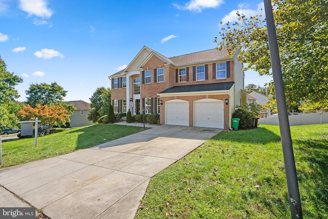 view of front of house featuring a garage and a front lawn