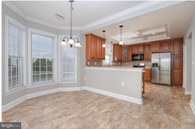 kitchen with pendant lighting, a healthy amount of sunlight, kitchen peninsula, and appliances with stainless steel finishes