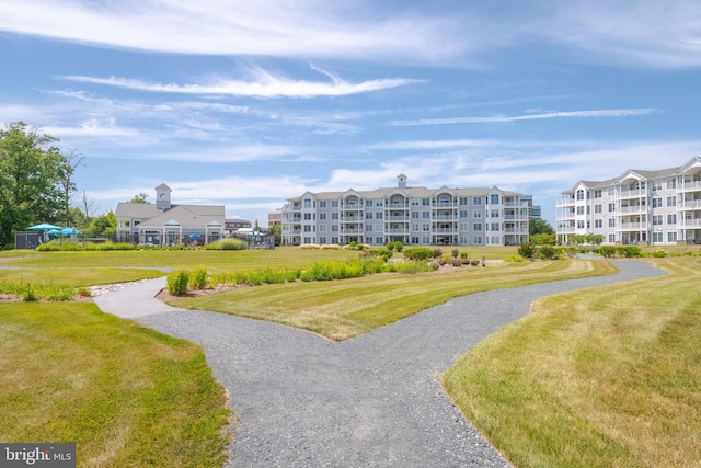 view of property's community with a lawn