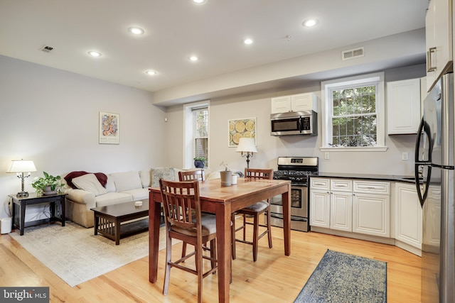 dining room with light hardwood / wood-style flooring