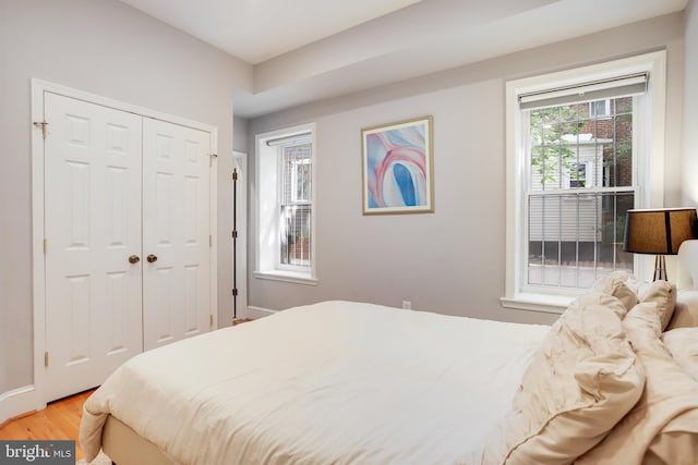 bedroom featuring hardwood / wood-style flooring and a closet