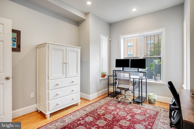 office area with wood-type flooring