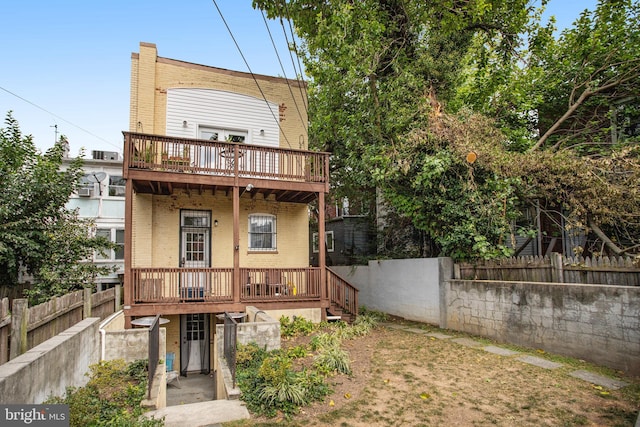 rear view of house with a deck