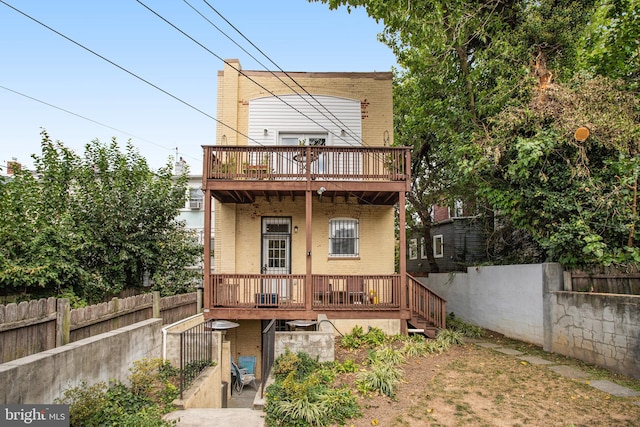 rear view of property with a deck