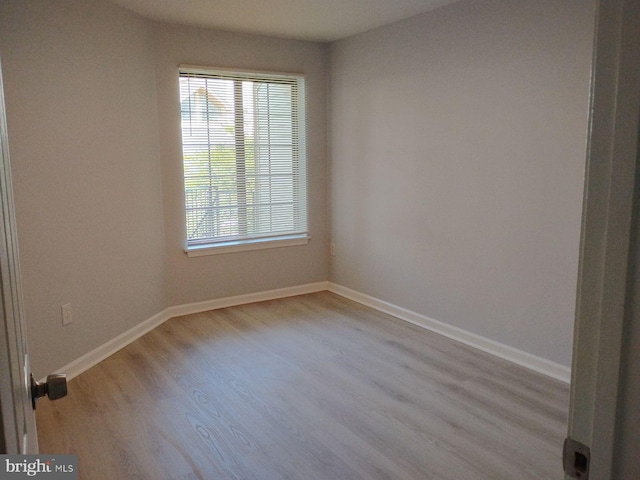 spare room with light hardwood / wood-style floors