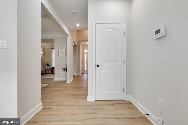 corridor with light hardwood / wood-style flooring