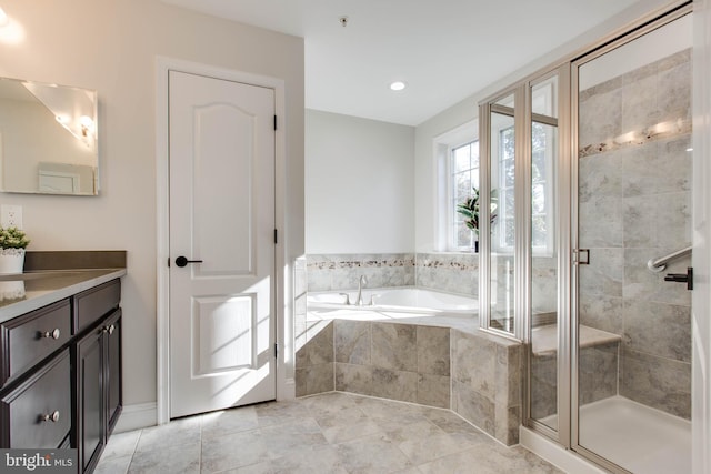 bathroom with vanity, independent shower and bath, and tile patterned flooring