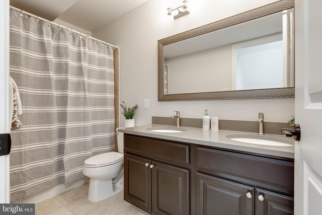 bathroom with vanity, toilet, tile patterned floors, and a shower with shower curtain