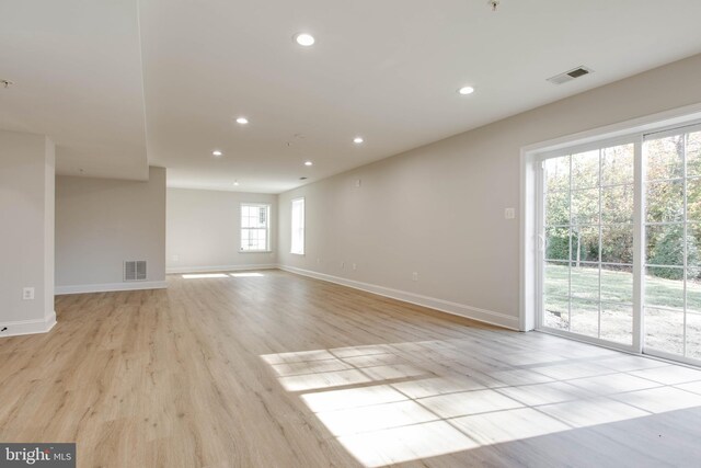 empty room with light hardwood / wood-style floors