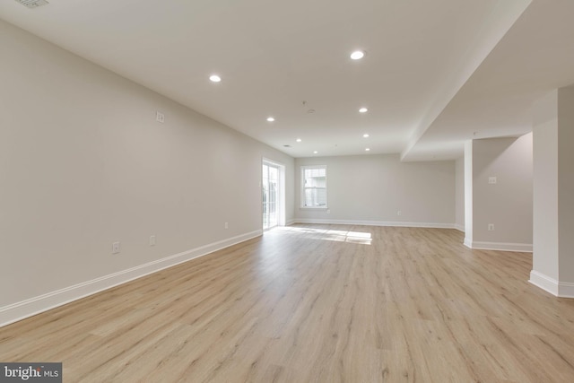 empty room with light hardwood / wood-style floors