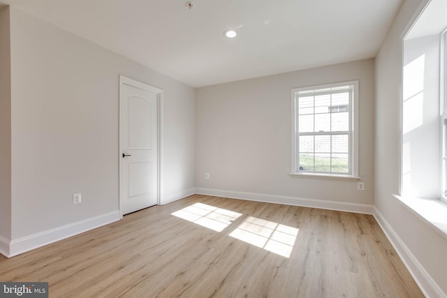 spare room featuring light hardwood / wood-style flooring