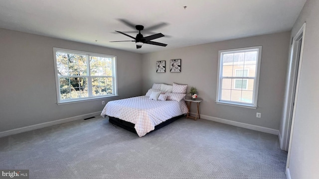 carpeted bedroom featuring ceiling fan