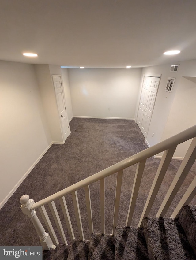 basement with dark carpet