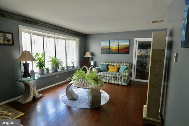 dining room with a baseboard radiator, sink, and dark hardwood / wood-style floors